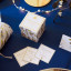 Talking Tables Botanical Mistletoe Christmas Trivia And Charades Game on the table