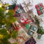 Talking Tables Botanical Mistletoe White Christmas Tissue Paper, 4-Piece with wrapped gifts