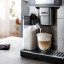 DeLonghi PrimaDonna Aromatic Bean to Cup Coffee Machine, ECAM630.75.TM on the kitchen island