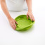 Lekue Silicone Collapsible Colander, 23cm - Green pressed on the kitchen counter