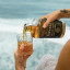 Finvara The Kings Gambit Irish Whiskey, 700ml poured in a glass at the beach