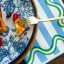 Tavola Wave Biodegradable Paper Napkins, Pack of 25 coastal blue under plate