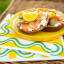 Tavola Wave Biodegradable Paper Napkins, Pack of 25 yellow under plate