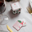 Talking Tables Botanical Christmas Trivia Game on the dinner table