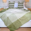 Aranda Hunter Olive Top Suede Throw, 200cm x 230cm on a bed