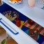 Popstrukt Sprinkles Chest of Drawers - Blueberry Splash with a plate and cutlery