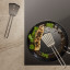 Eva Solo Stainless Steel Slotted Spatula with Silicone in a pan