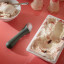 Eva Solo Green Tools Ice Cream Scoop with an ice cream tub