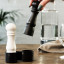 Crushgrind Mini Grinder Set, Black & White on the dinner table showing scale