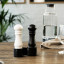 Crushgrind Mini Grinder Set, Black & White on the dinner table