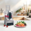 Cuisinart FlexPrep Food Processor, 1.1L on counter with a plate of food