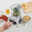 Cuisinart Pixie Chopper Mini Food Processor, 700ml on counter with ingredients 
