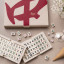 Printworks Reverra Mahjong Game open on a table