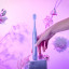 Ordo Sonic Lite Wicked Edition Electric Toothbrush - Wicked Glinda Purple on a stone