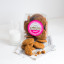 Mamamac's Ginger Biscuits open next to a glass of milk