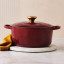 Le Creuset Signature 4.2 Litre Round Cast Iron Casserole, 24cm - Rhone on the kitchen counter