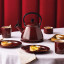 Le Creuset Kone Whistling Stovetop Kettle, 1.6L - Rhone on the table
