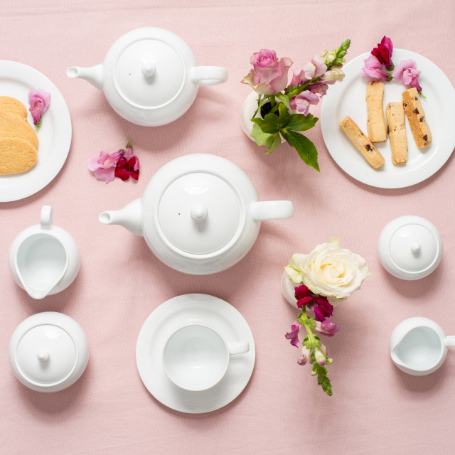 Noritake Arctic White Creamer Jug with a teapot, cup of tea and side plate with cookies
