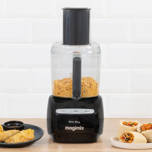 Magimix Le Mini Plus 1.7L Food Processor - Black on the table