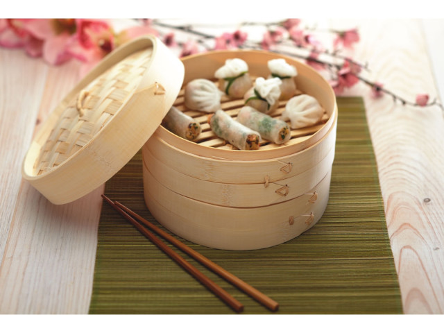 KitchenCraft Two Tier 20cm Bamboo Steamer With Lid, lifestyle with dumplings