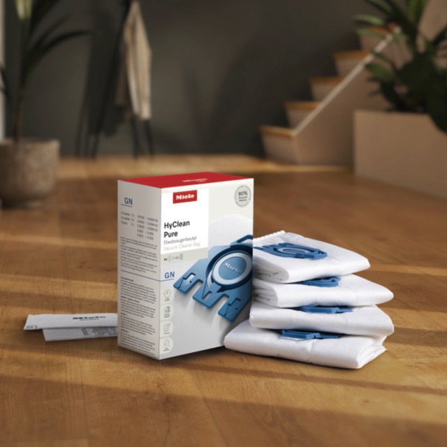 Miele GN Vacuum Cleaner Bags, Pack of 4 on the table
