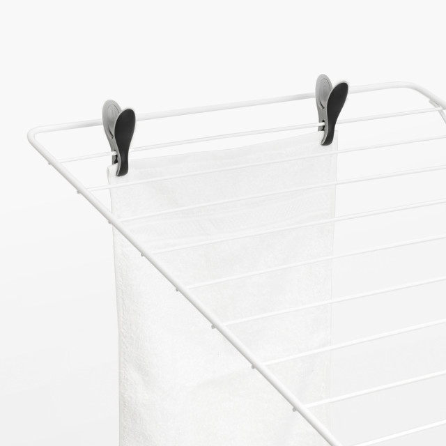 Brabantia Smart Clothes Pegs, Set of 8 - Black & Grey on a clothing rack