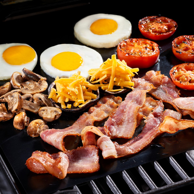 Mister Tjoppie Non-Stick Braai Sheet for Gas or Charcoal Grill with bacon and eggs breakfast