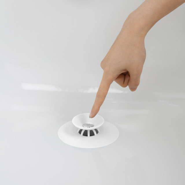 Umbra Flex Drain Cover - White in the bathtub