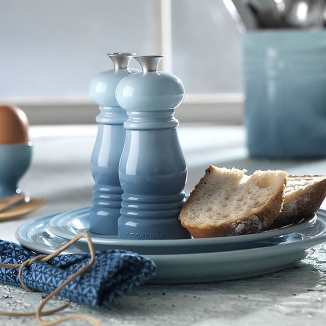 Le Creuset Classic Pepper Mill, 11cm on the table with a dinner set