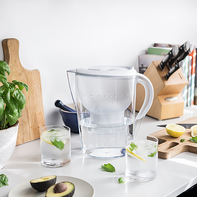 Brita Marella Large Water Filter Jug, 3.5L on the kitchen counter with glasses of water