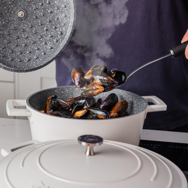 MasterClass Cast Aluminium 2.5L Casserole Pot, 20cm - Cream on the stove with mussels
