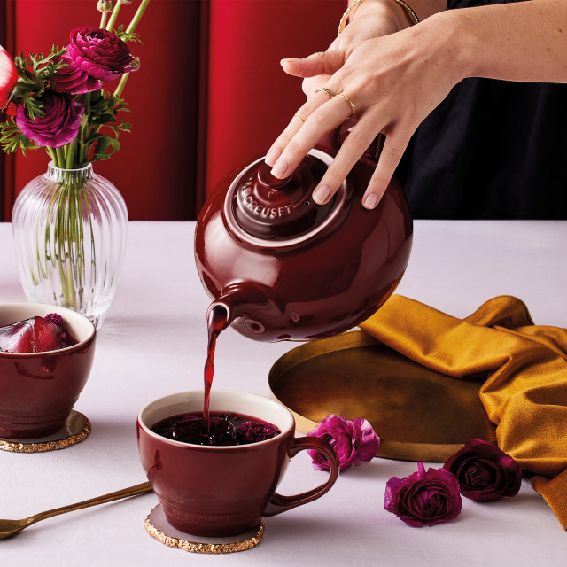 Le Creuset Stoneware Classic Teapot, 1.3L - Rhone with a teacup