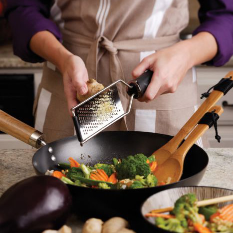 Microplane Gourmet Coarse Grater in use over pan of vegetables