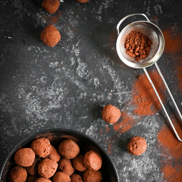MasterClass Stainless Steel Fine Mesh Sieves 7.5cm with cocoa powder next to a bowl of chocolate truffles