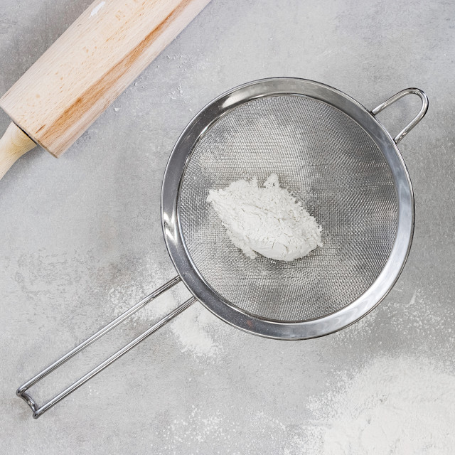 MasterClass Stainless Steel Fine Mesh Sieves 18cm with flour next to a rolling pin