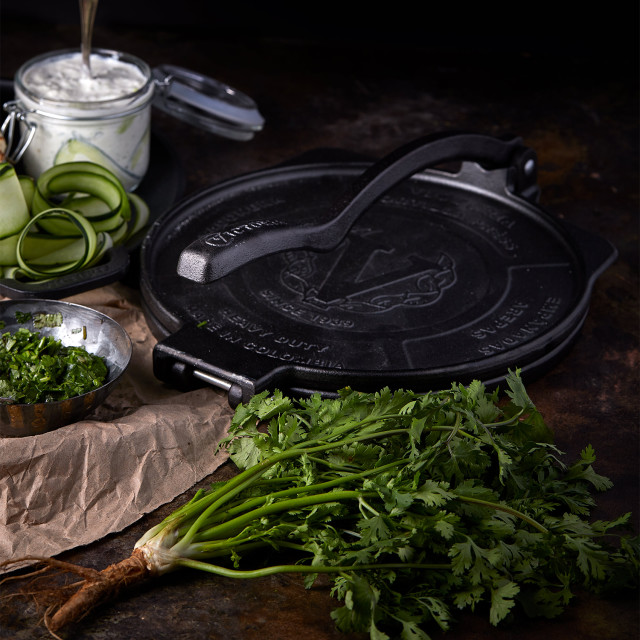Victoria Seasoned Cast Iron Tortilla Press - 25cm in use