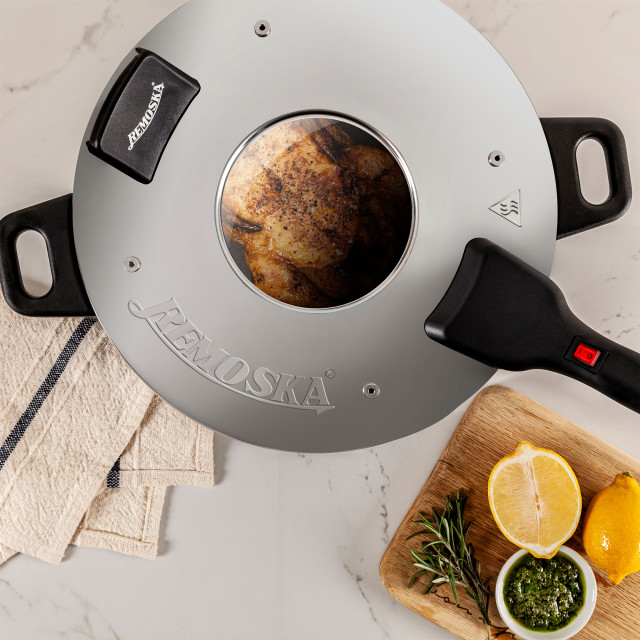 Remoska Energy Saving Portable Cooker Oven closed lid with chicken and other ingredients
