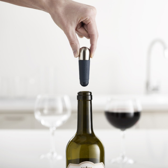 Joseph Joseph BarWise Twist-Lock Wine Stoppers being removed from a bottle