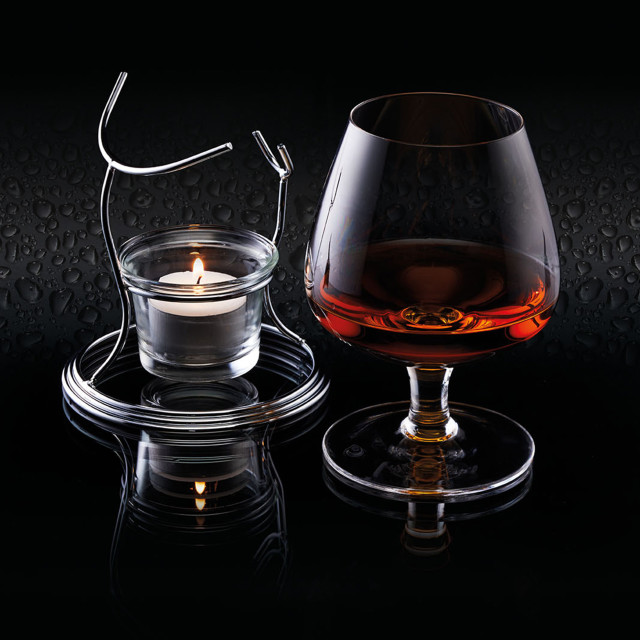 KitchenCraft BarCraft Brandy Glass Warmer Set in use in a dark setting