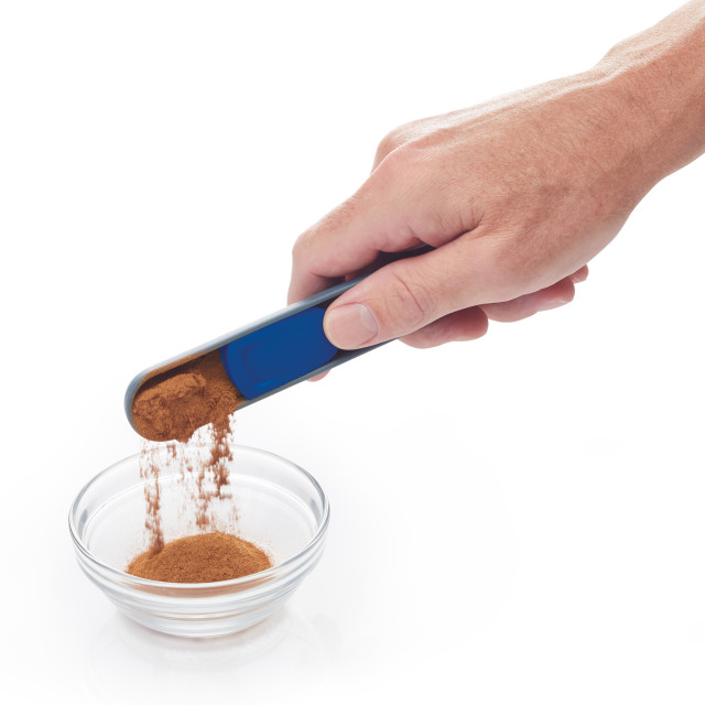 Lifestyle image of KitchenCraft Colourworks Brights Slide Adjusting Measuring Spoon