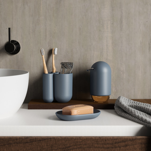 Umbra Touch Toothbrush Holder - Slate Blue  next to a basin