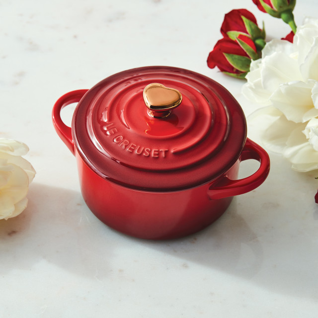 Lifestyle image of Le Creuset Mini Stoneware Cocotte with Gold Heart Knob, 10cm