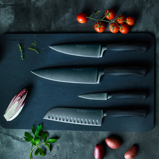 Performer range on chopping board with vegetables. Additional knives sold separately