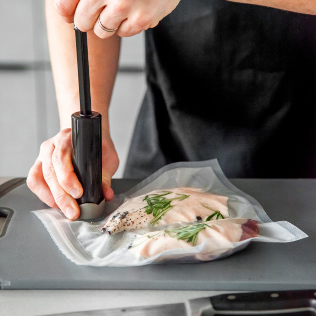 MasterClass Food Vacuum Sealer with 4 Reusable Polyethylene Food Bags in use