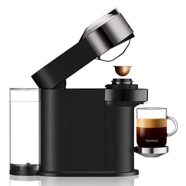 Nespresso Nespresso Dark Chrome Vertuo Next Automatic Espresso Machine side view with mug and capsule