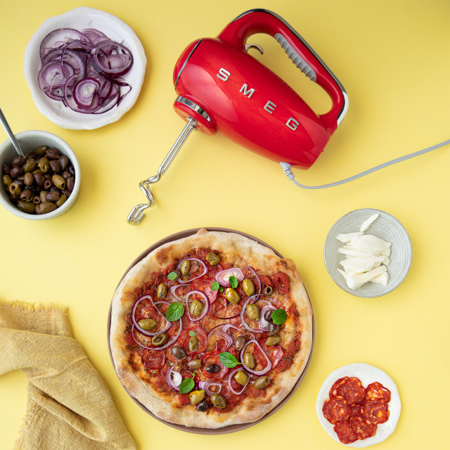 Smeg Retro Style Hand Mixer - Fiery red in use