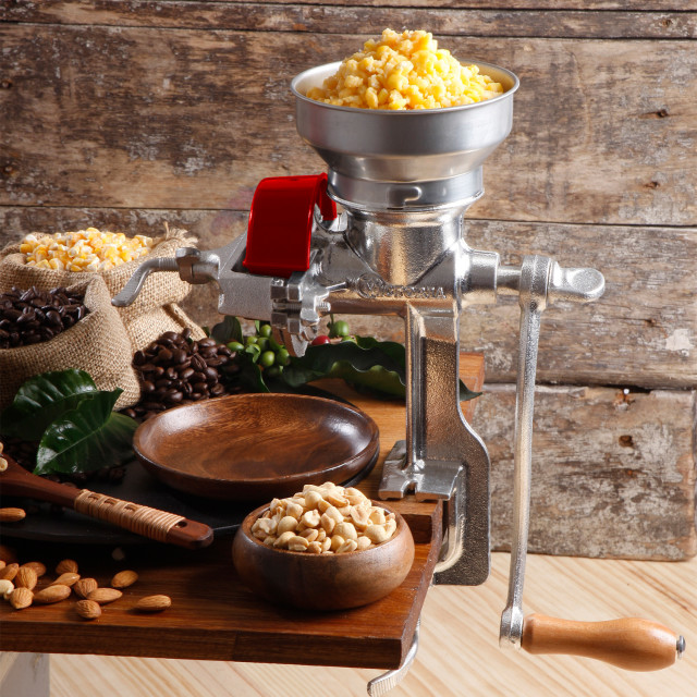Victoria Cast Iron Manual Grain Grinder with Low Hopper in use