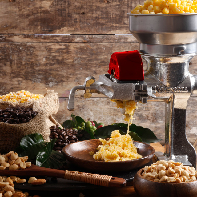 Victoria Cast Iron Manual Grain Grinder with Low Hopper in use