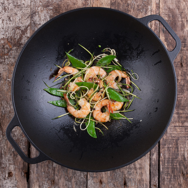 Victoria Matte Black Enamelled Cast Iron Wok with Handles, 36cm in use
