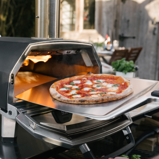 Ooni Ooni Karu Wood & Charcoal Fired Pizza Oven, 40cm in use